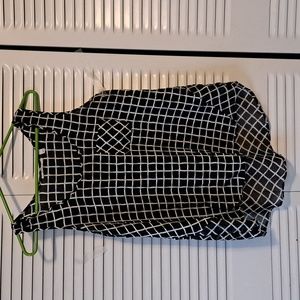 Sz M B/W Sleeveless top w hi front/ low back. Semi sheer at back at mid back.